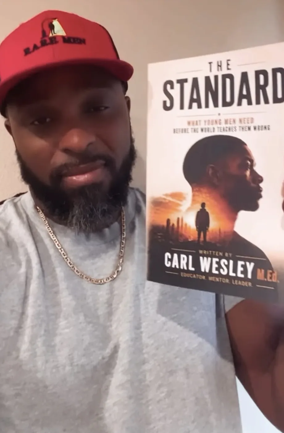Reader holding The Standard by Carl Wesley 10