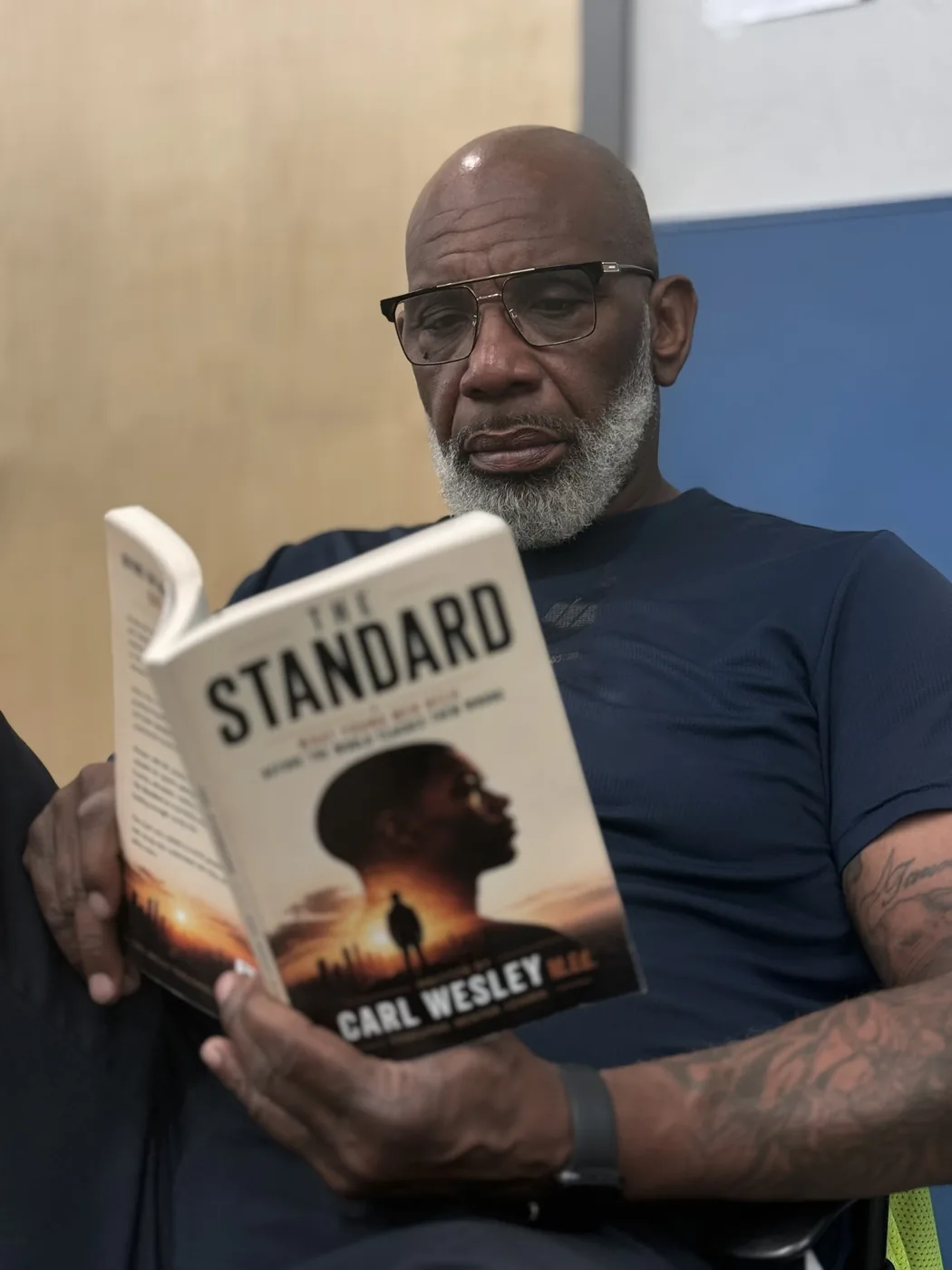 Reader holding The Standard by Carl Wesley 11
