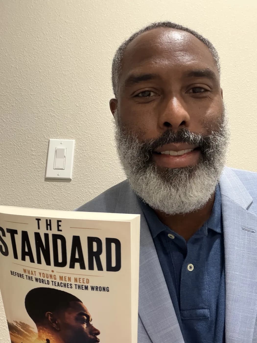 Reader holding The Standard by Carl Wesley 13