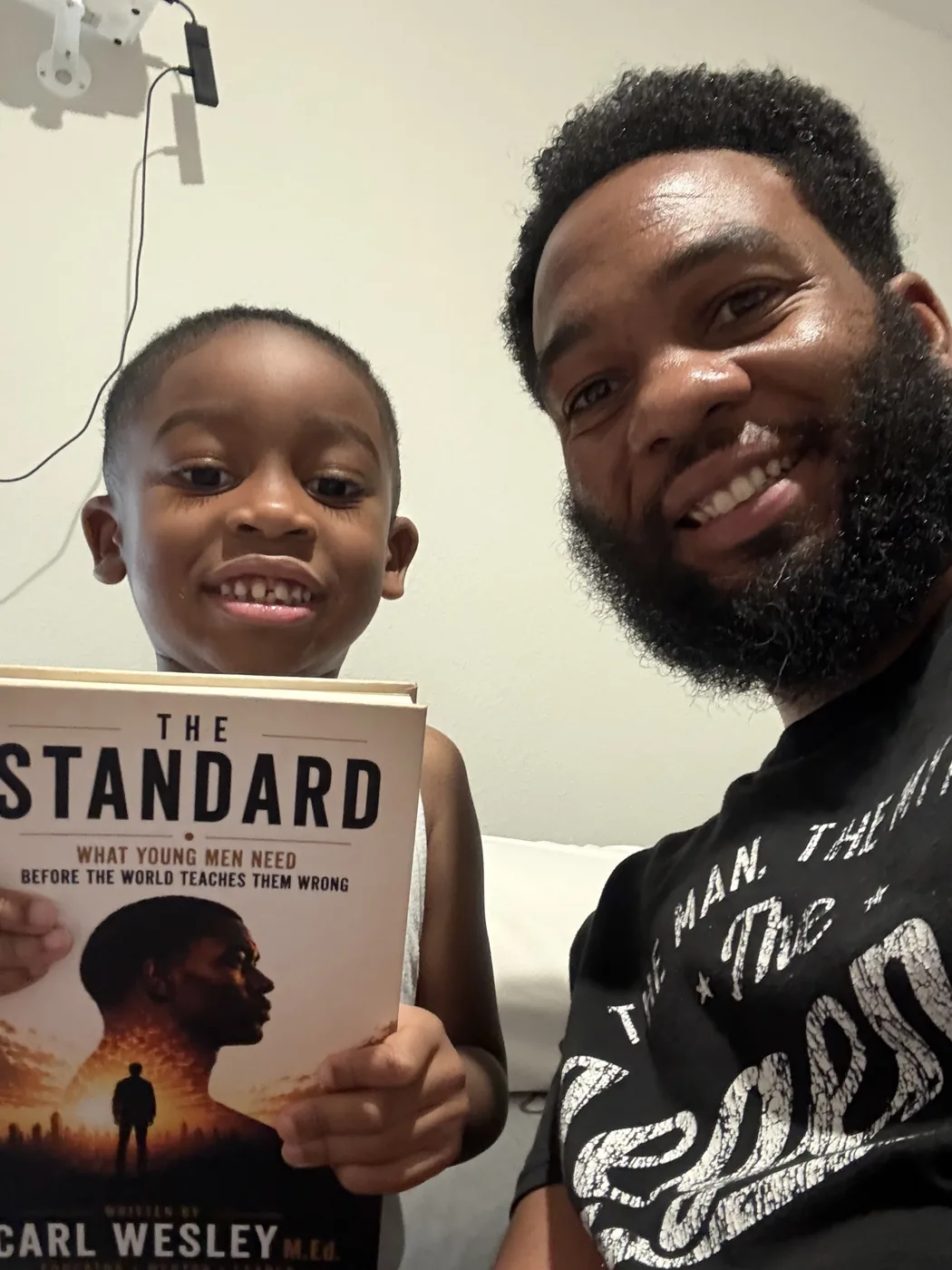 Reader holding The Standard by Carl Wesley 14