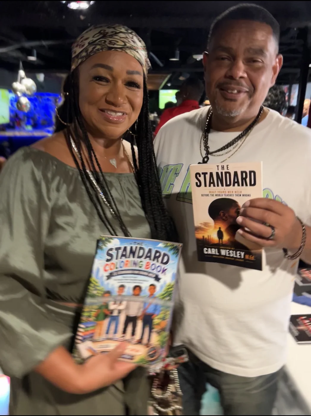 Reader holding The Standard by Carl Wesley 21