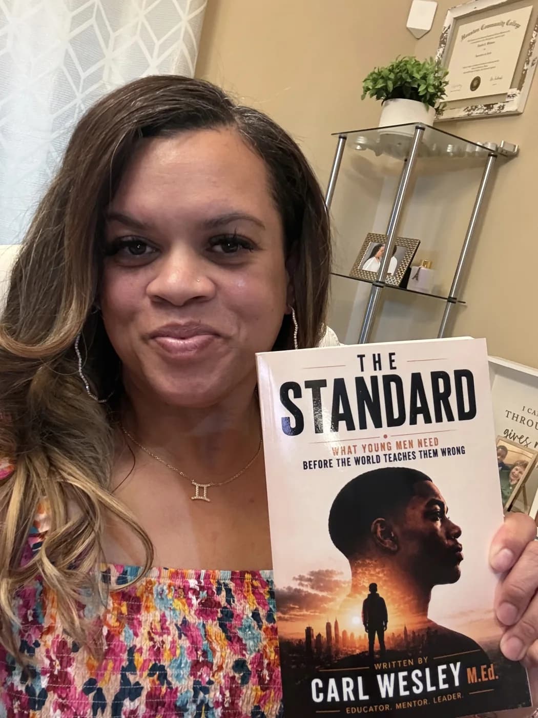 Reader holding The Standard by Carl Wesley 24