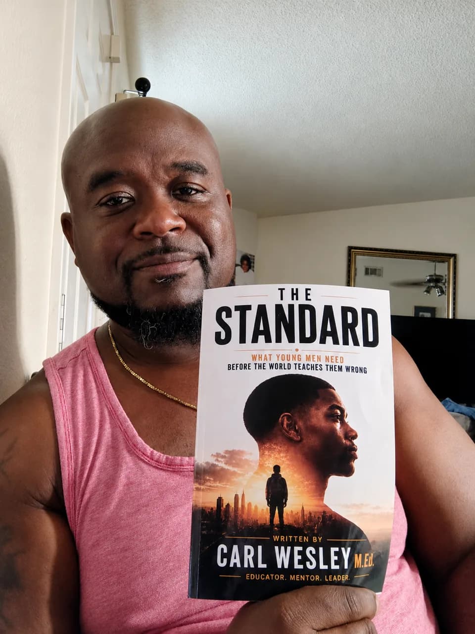 Reader holding The Standard by Carl Wesley